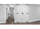 Hallway view with barn door closet and kitchen in background, connecting different parts of the house at 346 Ranch Rd, Tarpon Springs, FL 34688