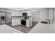 Well-equipped kitchen with stainless steel appliances, modern backsplash, quartz countertops, and ample counter space at 346 Ranch Rd, Tarpon Springs, FL 34688