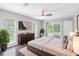 Spacious main bedroom with a ceiling fan, decor, sliding doors and exterior access at 346 Ranch Rd, Tarpon Springs, FL 34688
