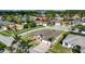 Aerial view of a single-story home on a well-manicured lot, showcasing beautiful landscaping and a paver driveway at 3625 Gaviota Dr, Ruskin, FL 33573
