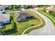 Aerial view showcasing the expansive lawn and surroundings of this corner lot home at 3625 Gaviota Dr, Sun City Center, FL 33573