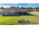 Charming home featuring a screened-in lanai, a spacious yard, and well-manicured landscaping at 3625 Gaviota Dr, Ruskin, FL 33573