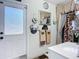 Cozy bathroom with a door to the outside, decorative towels, and stylish accents at 3625 Gaviota Dr, Ruskin, FL 33573
