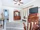 Comfortable bedroom with a vintage dresser, television, and sunny interior at 3625 Gaviota Dr, Ruskin, FL 33573