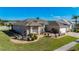 Beautifully landscaped home features mature landscaping, a three-car garage, and impeccable curb appeal at 3625 Gaviota Dr, Ruskin, FL 33573