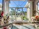 Bright foyer with glass doors framing lush landscaping and a brick walkway under a sunny blue sky at 3625 Gaviota Dr, Ruskin, FL 33573