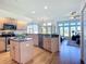 Open concept kitchen with granite countertops, stainless steel appliances, and hardwood floors at 3625 Gaviota Dr, Ruskin, FL 33573