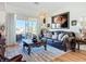 Comfortable living room with a view of the screened patio and elegant decorations at 3625 Gaviota Dr, Ruskin, FL 33573