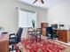 Bright home office featuring a comfortable office chair, a desk, and natural light at 3625 Gaviota Dr, Ruskin, FL 33573