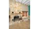 Living room featuring stone fireplace, tile floors, and white-beamed ceiling at 366 La Hacienda Dr, Indian Rocks Beach, FL 33785