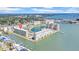 Stunning aerial view of the condominium complex surrounded by water with beautiful bay views at 4725 Cove Cir # 302, St Petersburg, FL 33708
