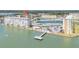Waterfront condo complex with a private beach, swimming pool, fishing pier, and convenient parking for residents and guests at 4725 Cove Cir # 302, St Petersburg, FL 33708