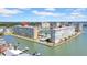 Scenic waterfront condo complex with boat docks and a tranquil waterway, providing a serene and luxurious living experience at 4725 Cove Cir # 302, St Petersburg, FL 33708