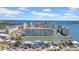 Beautiful aerial view of a waterfront condo complex with stunning views, boat docks, and well-manicured landscaping at 4725 Cove Cir # 302, St Petersburg, FL 33708