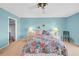 Cozy bedroom with ceiling fan, closet access, and matching bedside lamps at 4725 Cove Cir # 302, St Petersburg, FL 33708