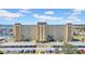 Exterior shot of a multi-story condo building with well-maintained landscaping at 4725 Cove Cir # 302, St Petersburg, FL 33708