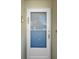 A picture showing unit number on a clean white door with security screen at 4725 Cove Cir # 302, St Petersburg, FL 33708