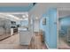 Bright kitchen features stainless steel appliances and island with granite countertop at 4725 Cove Cir # 302, St Petersburg, FL 33708