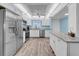 Well-lit kitchen featuring stainless steel appliances, ample cabinetry, and a stylish countertop island at 4725 Cove Cir # 302, St Petersburg, FL 33708
