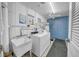Clean laundry room with utility sink, washing machine and dryer, and storage lockers at 4725 Cove Cir # 302, St Petersburg, FL 33708