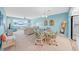 Spacious open-concept living area combines dining and living spaces with an airy feel at 4725 Cove Cir # 302, St Petersburg, FL 33708