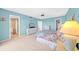 Spacious main bedroom featuring a comfortable bed, dresser, television, ceiling fan, and private bathroom at 4725 Cove Cir # 302, St Petersburg, FL 33708