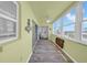 Bright sun room with lots of windows overlooking the bay and a pull down table at 4725 Cove Cir # 302, St Petersburg, FL 33708