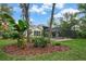 A backyard view featuring a screened-in pool and patio area with lush landscaping at 5806 Terncrest Dr, Lithia, FL 33547