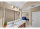 Bathroom featuring single vanity and tile flooring with a glimpse into the adjacent bedroom at 5806 Terncrest Dr, Lithia, FL 33547
