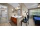 Bathroom featuring double vanity, tile flooring, and views into other rooms at 5806 Terncrest Dr, Lithia, FL 33547