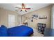 Bright bedroom with a window, and a view into the bathroom at 5806 Terncrest Dr, Lithia, FL 33547