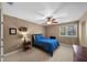 Comfortable bedroom with neutral paint, carpet, and a window letting in natural light at 5806 Terncrest Dr, Lithia, FL 33547
