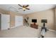 Open Bonus Room featuring an open floor plan, TV, exercise equipment, and carpet at 5806 Terncrest Dr, Lithia, FL 33547