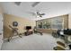 Spacious bonus room with fitness equipment, seating area, and plenty of natural light at 5806 Terncrest Dr, Lithia, FL 33547