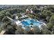 Aerial view of the community pools, umbrellas, seating, landscaping, and community buildings at 5806 Terncrest Dr, Lithia, FL 33547