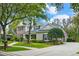 Charming home with well-kept lawn, tasteful landscaping, mature trees, and inviting driveway at 5806 Terncrest Dr, Lithia, FL 33547