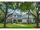 Charming two-story home with stone accents, lush landscaping, and a well-manicured lawn at 5806 Terncrest Dr, Lithia, FL 33547