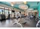 Bright community fitness center with modern exercise equipment, weights, treadmills, and large windows at 5806 Terncrest Dr, Lithia, FL 33547