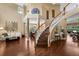 Spacious foyer with hardwood floors, grand staircase, and ample natural light at 5806 Terncrest Dr, Lithia, FL 33547