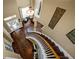 Elegant foyer with hardwood floors, a curved staircase, and a stylish chandelier at 5806 Terncrest Dr, Lithia, FL 33547