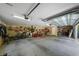 Spacious garage with ample storage space, bikes, equipment, and open door with natural light at 5806 Terncrest Dr, Lithia, FL 33547