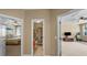 Hallway with views into the bedroom, bathroom, and exercise room at 5806 Terncrest Dr, Lithia, FL 33547