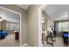 Upstairs hallway showcasing access to bedrooms with neutral walls and carpeted flooring at 5806 Terncrest Dr, Lithia, FL 33547