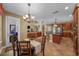 Open kitchen with breakfast nook features center island, cherry cabinets, stainless steel appliances, and natural light at 5806 Terncrest Dr, Lithia, FL 33547