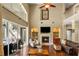 Bright living room featuring a fireplace, built-in shelves, and access to an outdoor grill at 5806 Terncrest Dr, Lithia, FL 33547