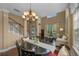 Open-concept living room with dining area features vaulted ceilings, hardwood flooring, and natural light at 5806 Terncrest Dr, Lithia, FL 33547