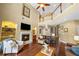 Inviting living room with a fireplace, built-in shelves, and hardwood floors at 5806 Terncrest Dr, Lithia, FL 33547