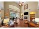 Spacious living room with a fireplace, built-in shelves, and soaring ceilings at 5806 Terncrest Dr, Lithia, FL 33547