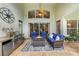 Covered patio with an outdoor kitchen, fire pit, and comfortable seating, perfect for relaxing or entertaining at 5806 Terncrest Dr, Lithia, FL 33547
