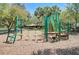 A colorful community playground with swings, climbing structures, and play equipment in a safe, mulched area at 5806 Terncrest Dr, Lithia, FL 33547